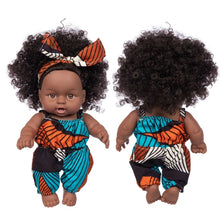 Poupon noir en tenue traditionnelle africaine bleu et orange